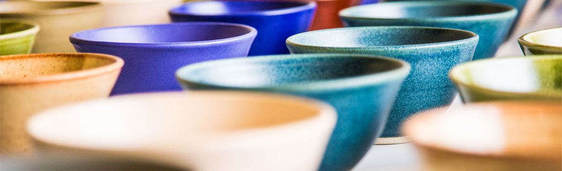 A student BFA show featuring ceramic bowls