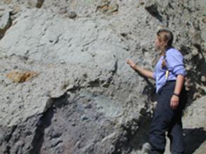 Patricia Heiser pointing to silt bodies within the lahar deposit
