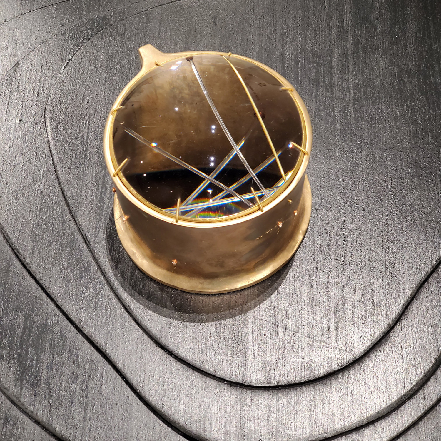 Cast bronze, reclaimed lens, fiber optic filament, 5.75 x 4.75 x 5.25", image courtesy of Christen Booth