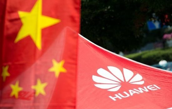  Chinese flag in foreground and tent with Huawei logo in background