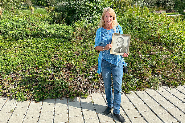 Photo by Julie Stricker. Jennifer Shanly Boll holds a photo of her grandfather John Shanly, the first graduate from what is today the University of Alaska Fairbanks. She toured the university and visited a variety of agriculture programs, including the Georgeson Botanical Garden, on Aug. 1, 2023.