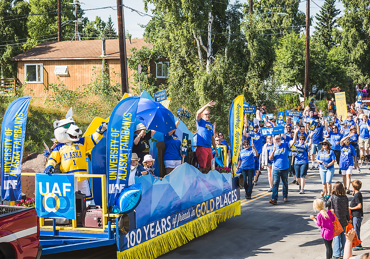 Members of Nanook Nation wear their blues and golds during the 2017 Golden Days Grande Parade in downtown Fairbanks on July 22. Judges awarded UAF’s float, which celebrated the university’s centennial, as the best noncommercial entry.