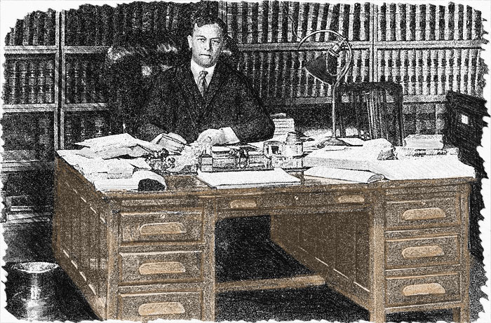 Bunnell seated at desk
