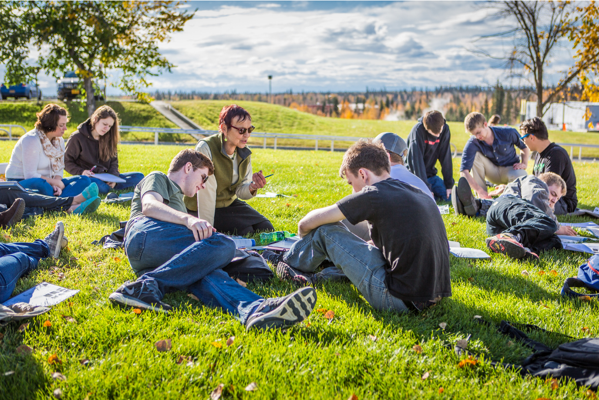 A German foreign language class holds class on the campus lawn during a warm autumn afternoon. | UAF Photo by JR Ancheta