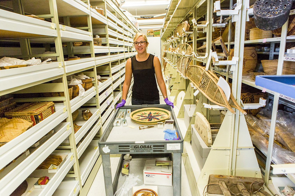 Student assistant Kirsten Olson collects specimens from the stacks at the University of Alaska Museum of the North.