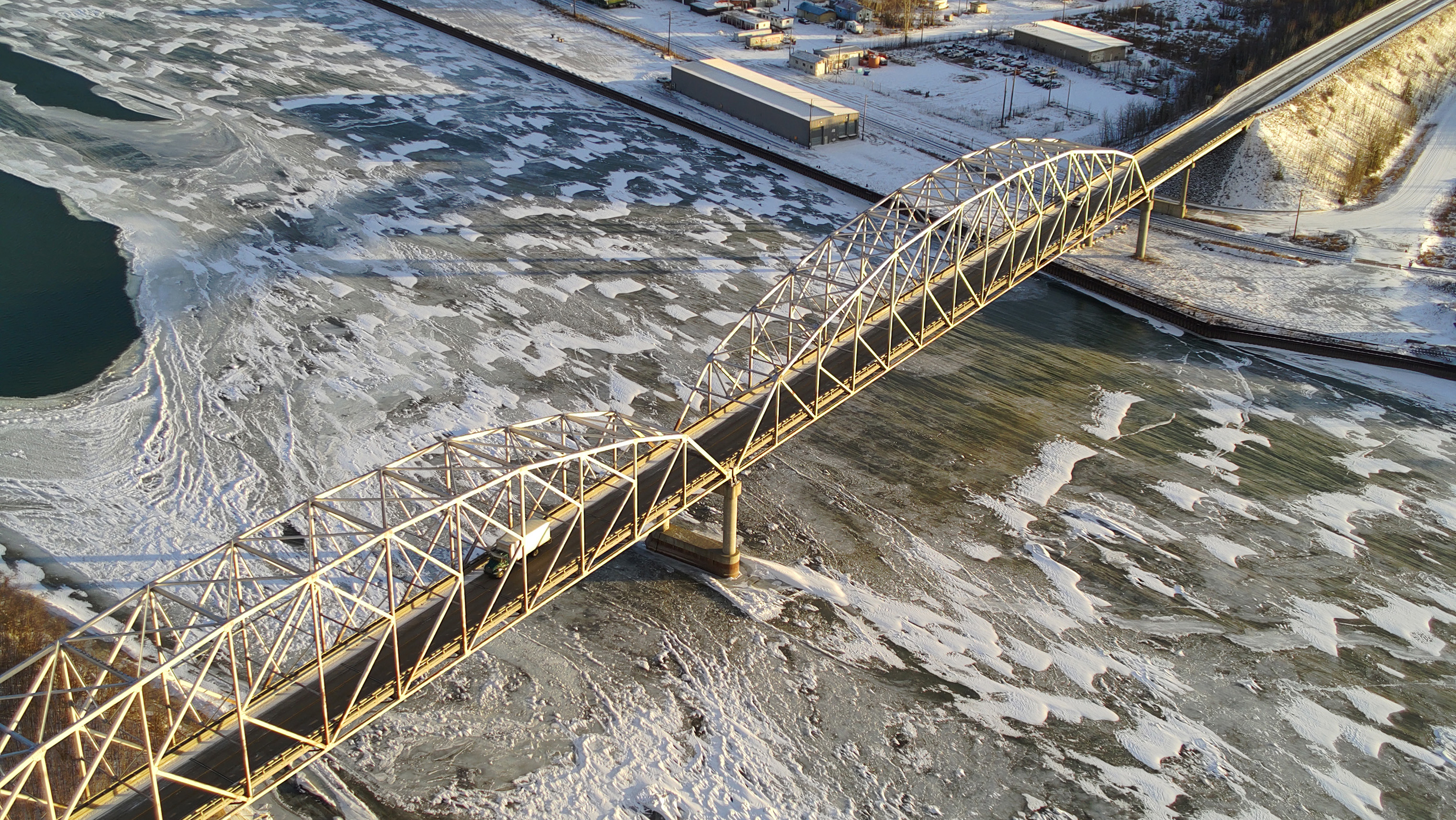Ice begins to form on the Tanana River under the Parks Highway bridge at Nenana in November 2022. Climate projections tailored for infrastructure needs in Alaska, which can be critical when building bridges and roads, are now available on the new Arctic EDS website.
