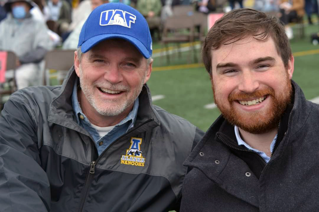 2 guys smiling, left john decked out in UAF gear
