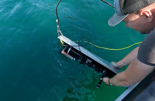 Dr. Roddewig deploys a Sea-Bird ac-s spectral absorption and attenuation sensor.