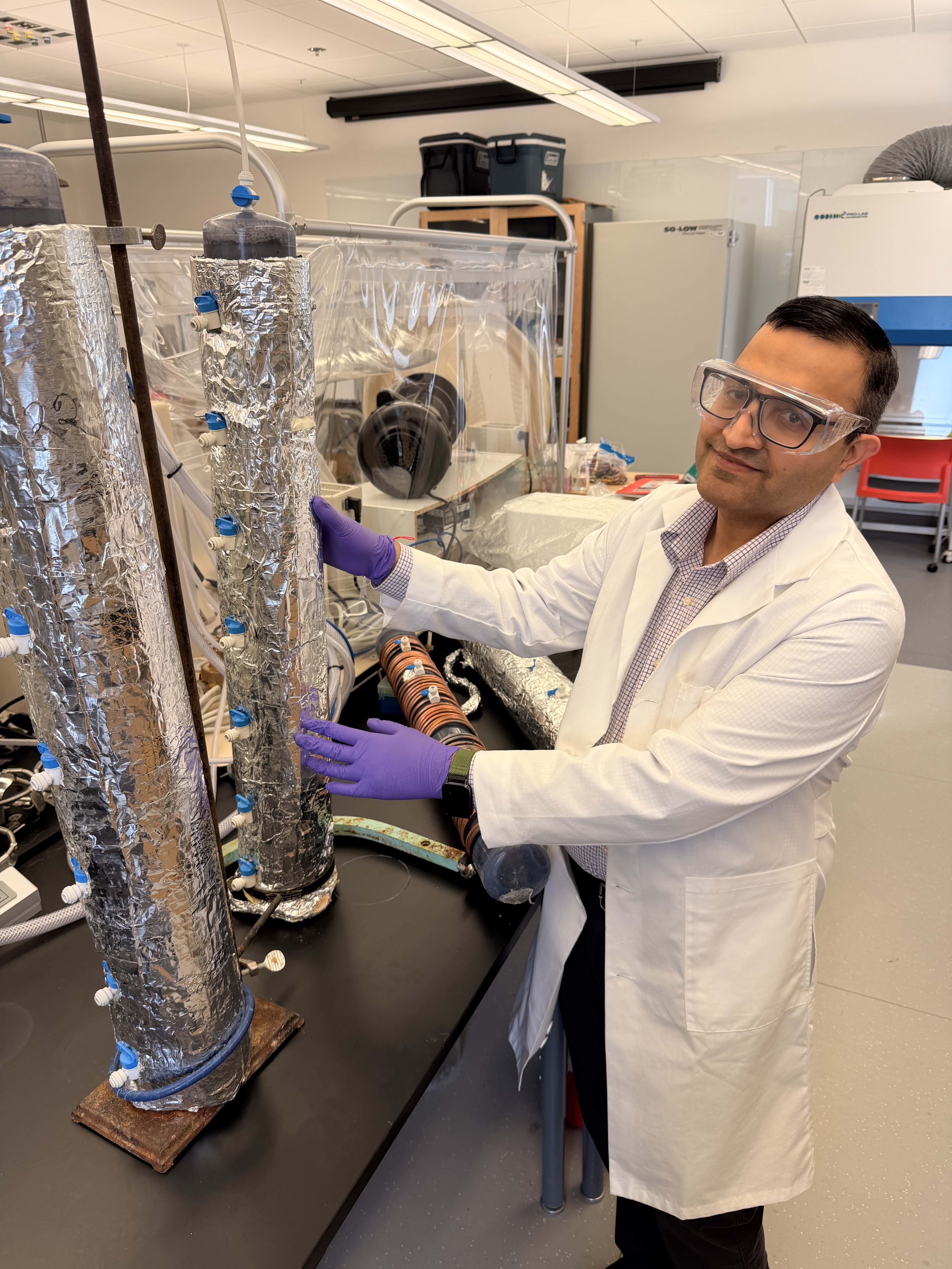 Srijan Aggarwal, UAF professor of environmental engineering, works with laboratory equipment used in his research on critical mineral recovery. Aggarwal is part of a $6 million National Science Foundation collaboration investigating how biological processes and artificial intelligence can improve the recovery of rare earth elements from waste materials.
