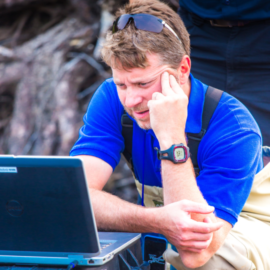 Jimmy Fox, reviews video captured from an unmanned aerial vehicle