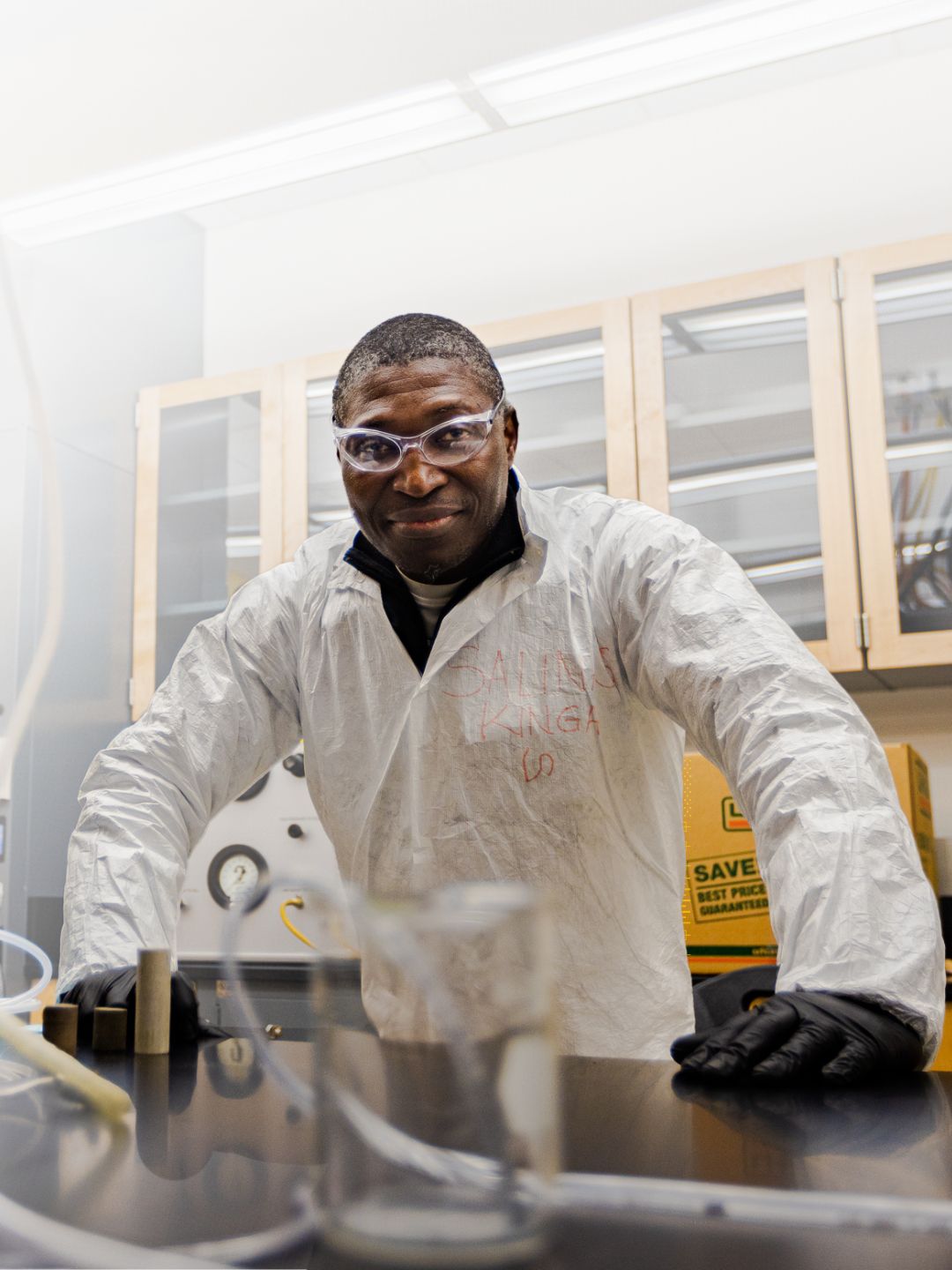 A researcher stands in a lab