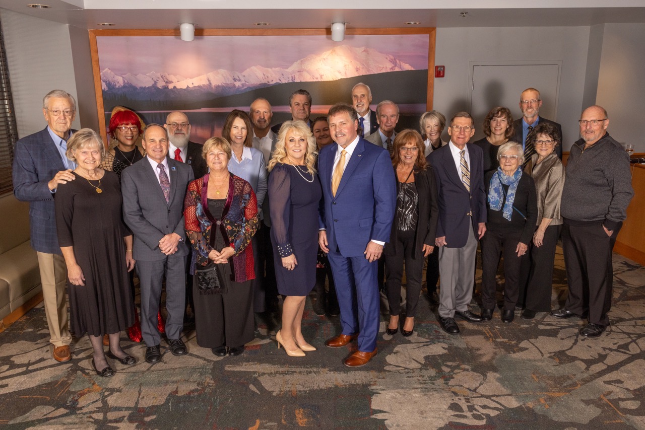 Previous UAF Business Leader of the Year award recipients stand together at the Westmark Fairbanks Hotel.