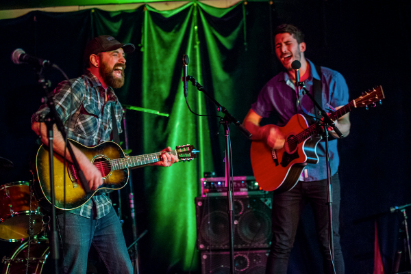 Musicians performing on stage at the pub