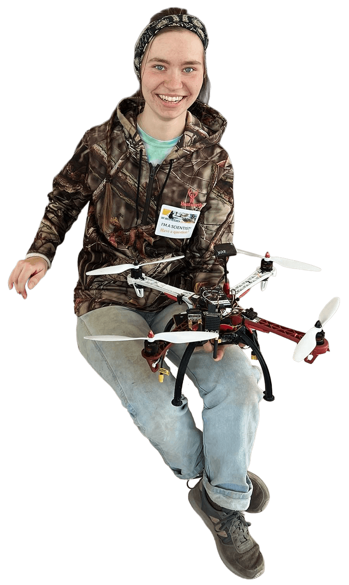 Student holding drone