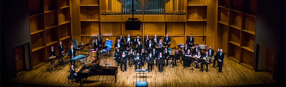 A musical ensemble on the stage at the Davis Concert Hall