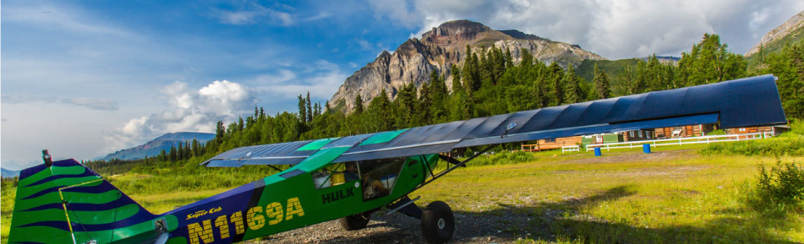 A modified Piper Super Cub airplane near the Wrangell-St. Elias National Park and Preserve.