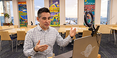 Michael Angiak works with student teachers during an online class at the School of Education in the Gruening Building on the UAF campus.