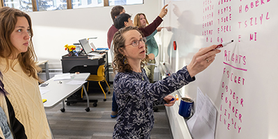 Professor instructing students during a class