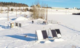 The Solar Test Site at the University of Alaska Fairbanks measures albedo off the snow with its bifacial solar panels and is part of a solar data collection project across the state. Photo by Amanda Byrd.