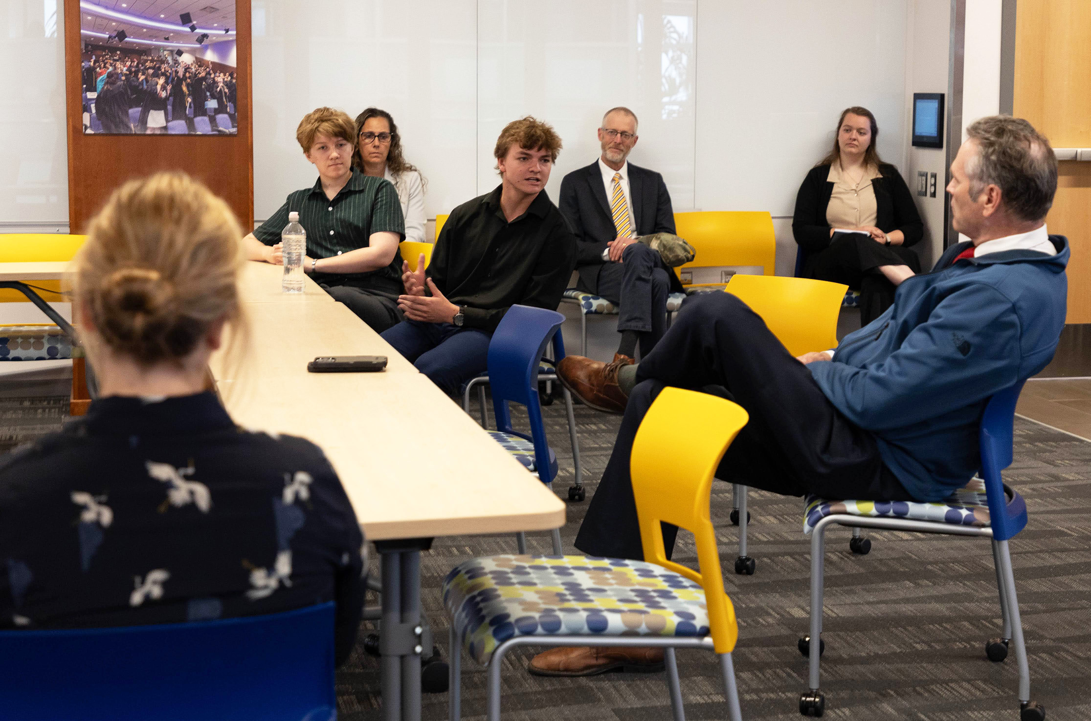 ACEP intern Liam Chelkowski speaks to Governor Dunleavy about his research.