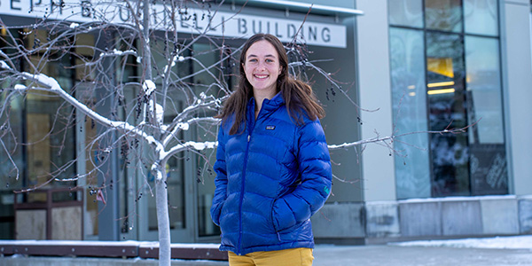 A person standing in front of a building
