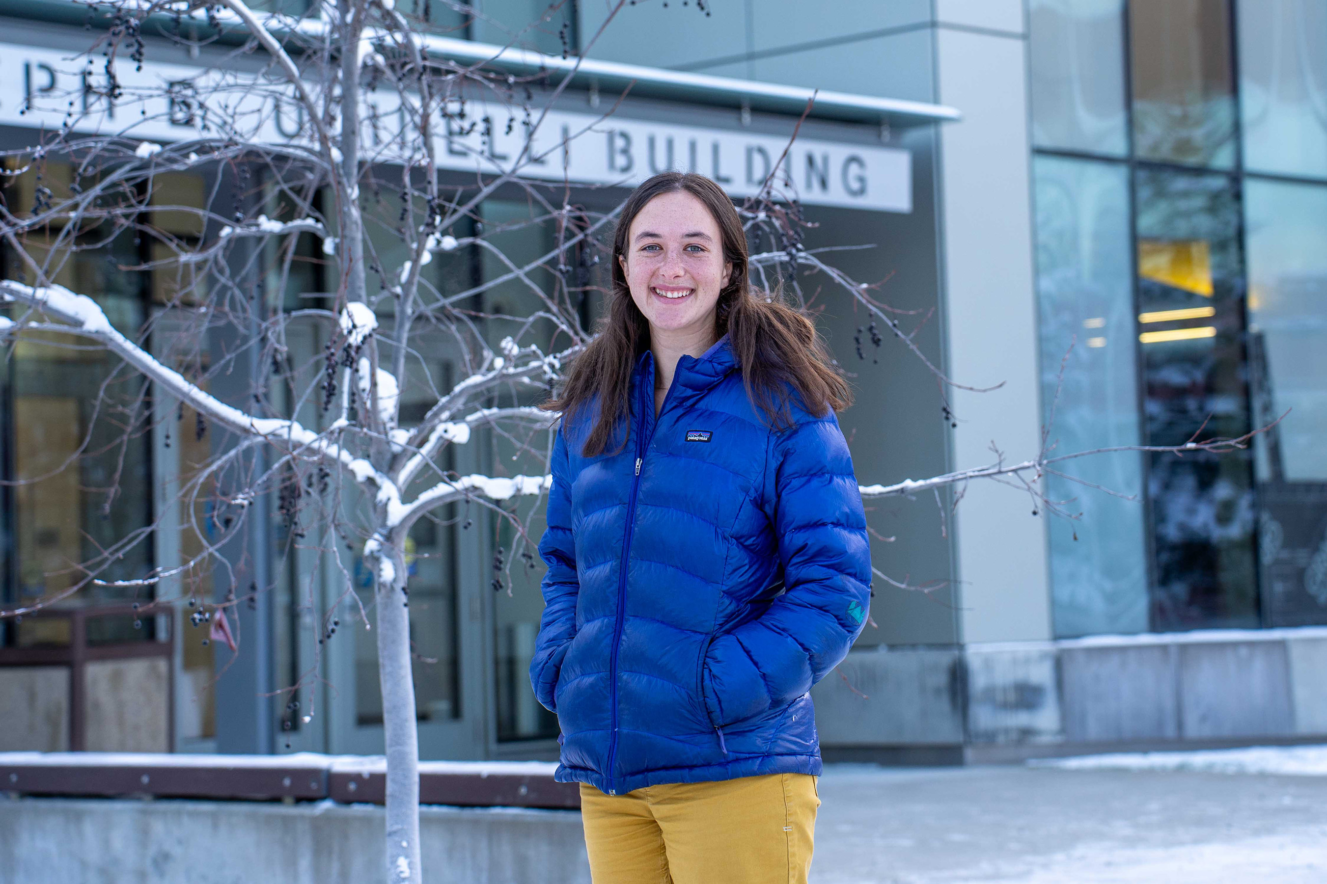 A person standing in front of a building