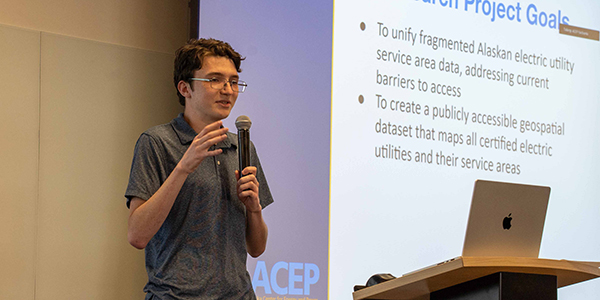 ACEP summer intern Liam England gives a presentation on his project. Photo by Yuri Bult-Ito/ACEP.