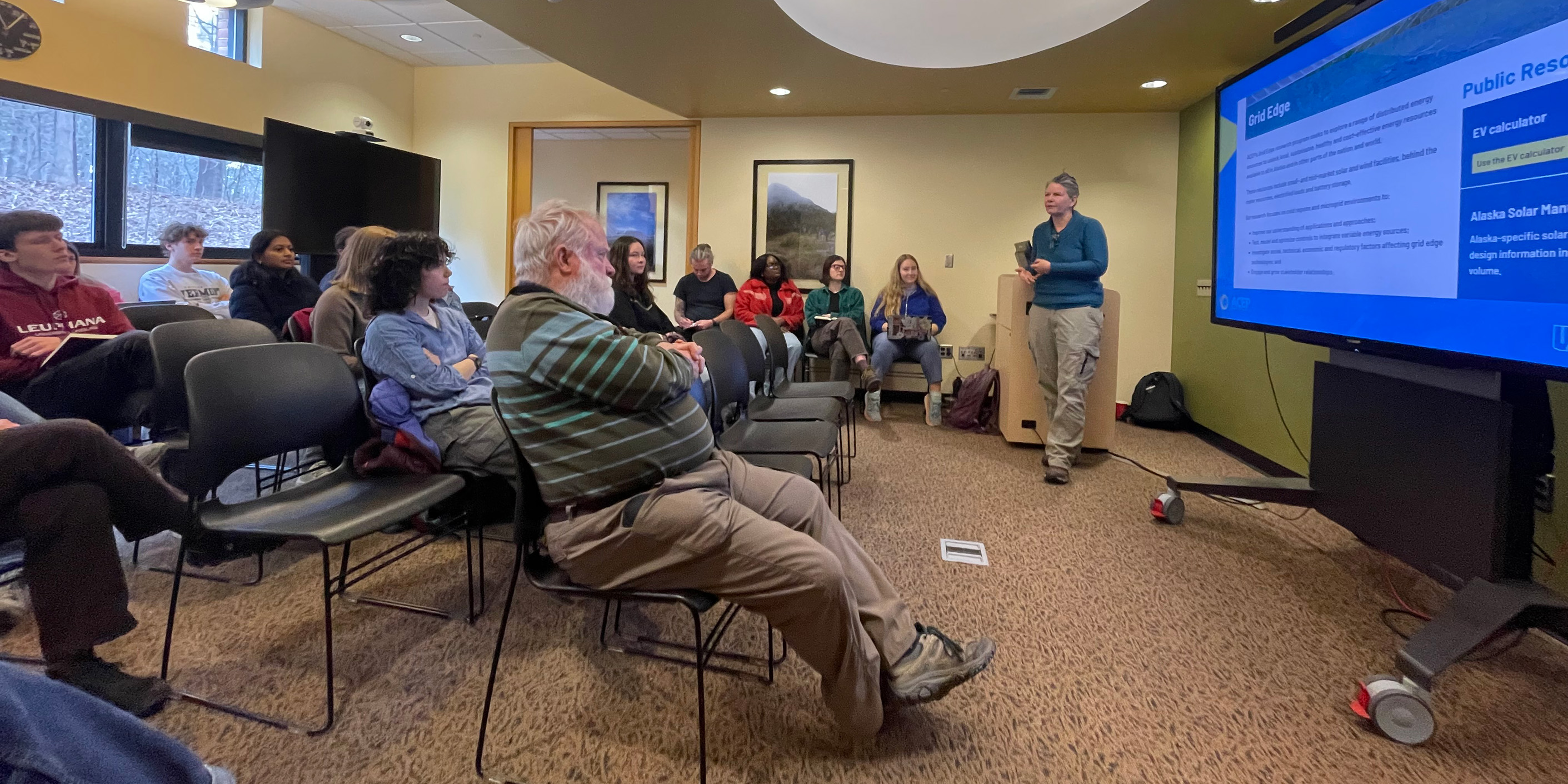 A person is giving a presentation to a group of people