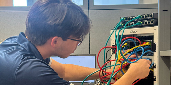 A person working on wires.