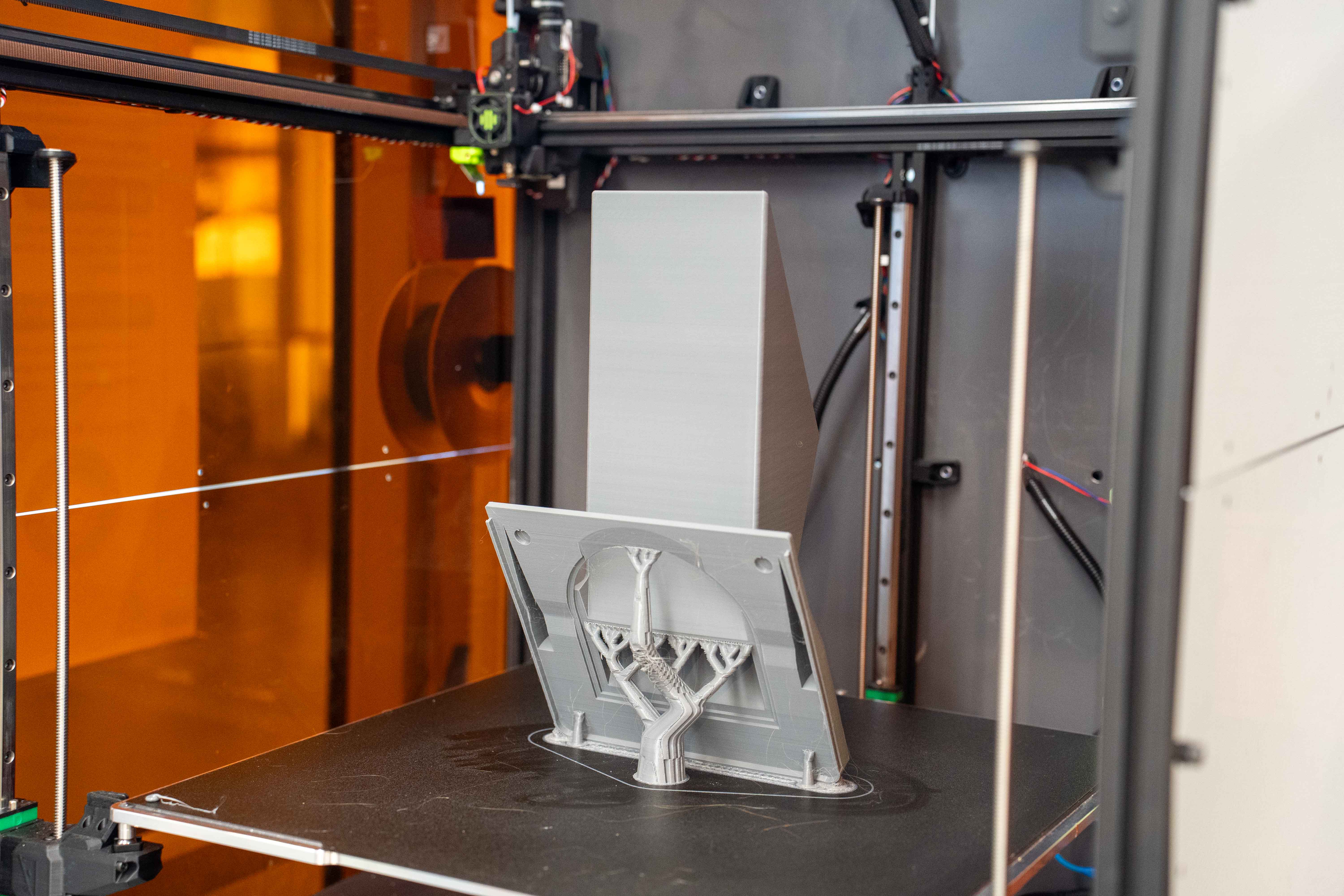 A hood sits in a 3D printer