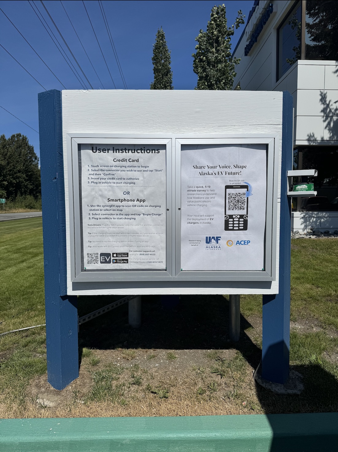 ACEP survey displayed at an electric vehicle charger information board