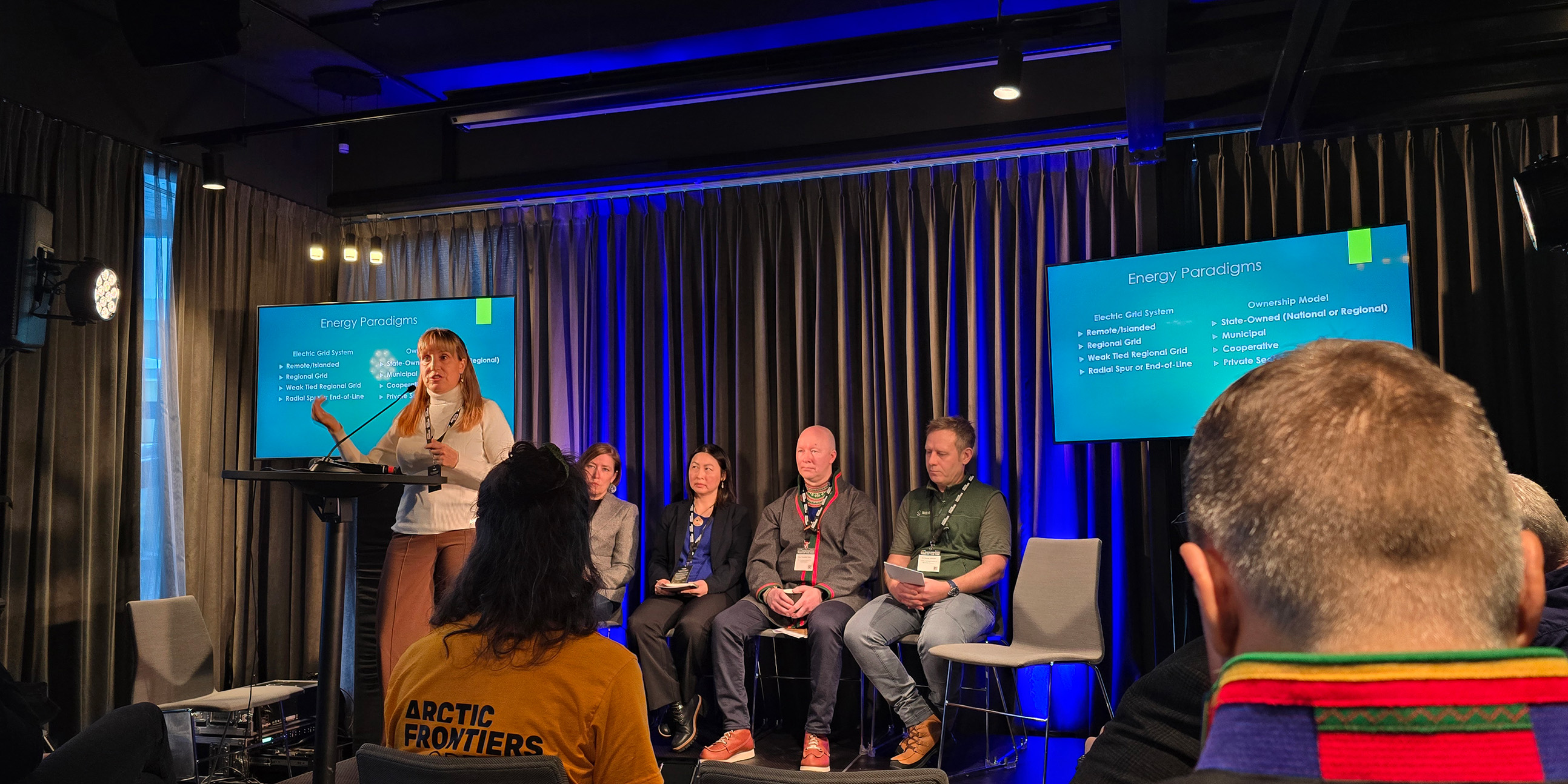 A person gives a talk on stage