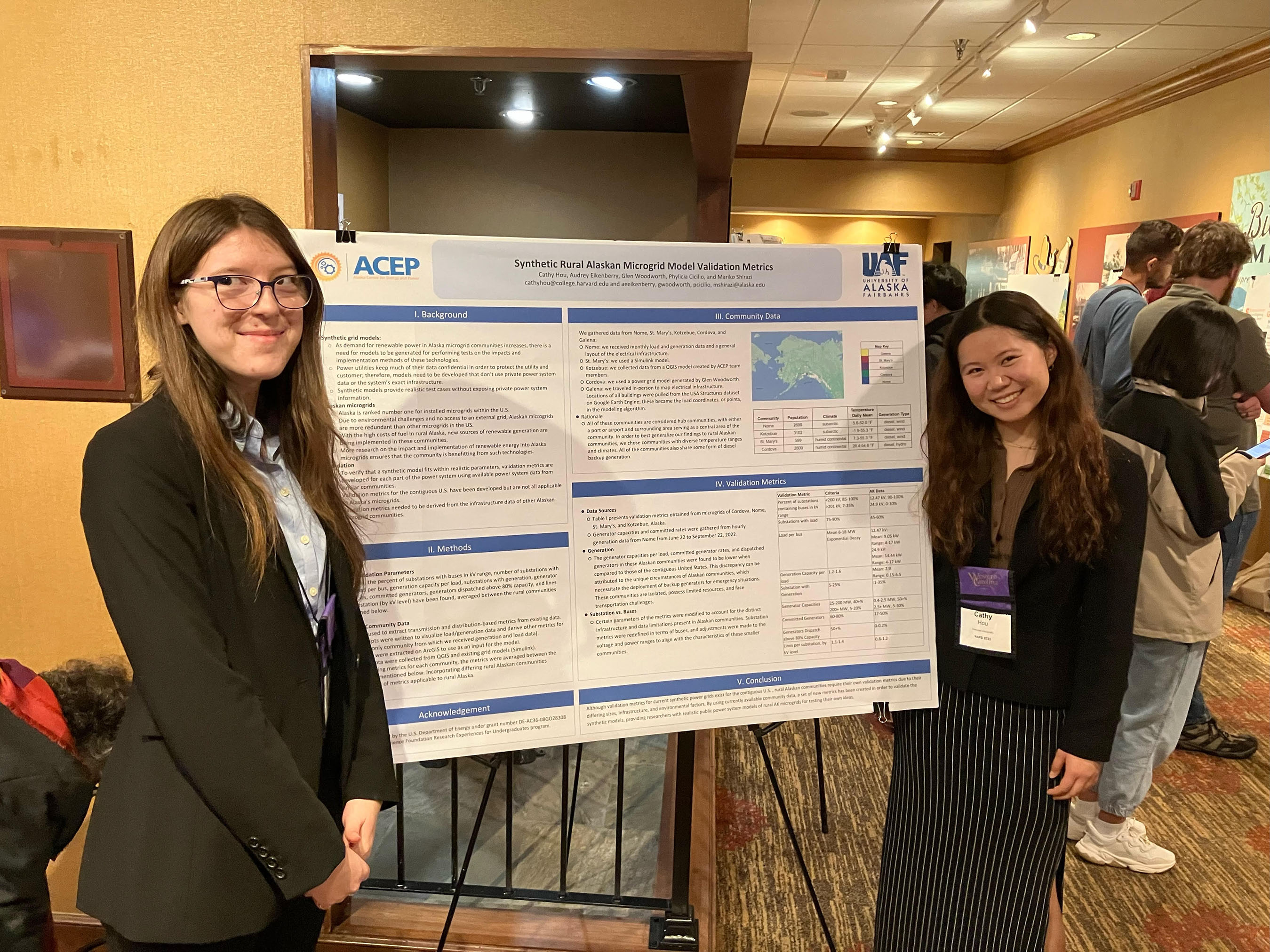 Audrey Eikenberry and Cathy Hou present their poster at the North American Power Symposium.