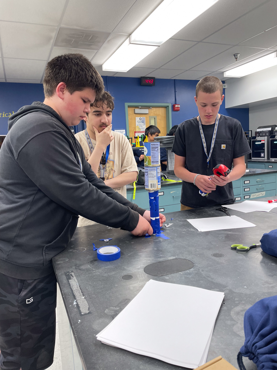 The summer session participants compete in a weight-lifting design challenge