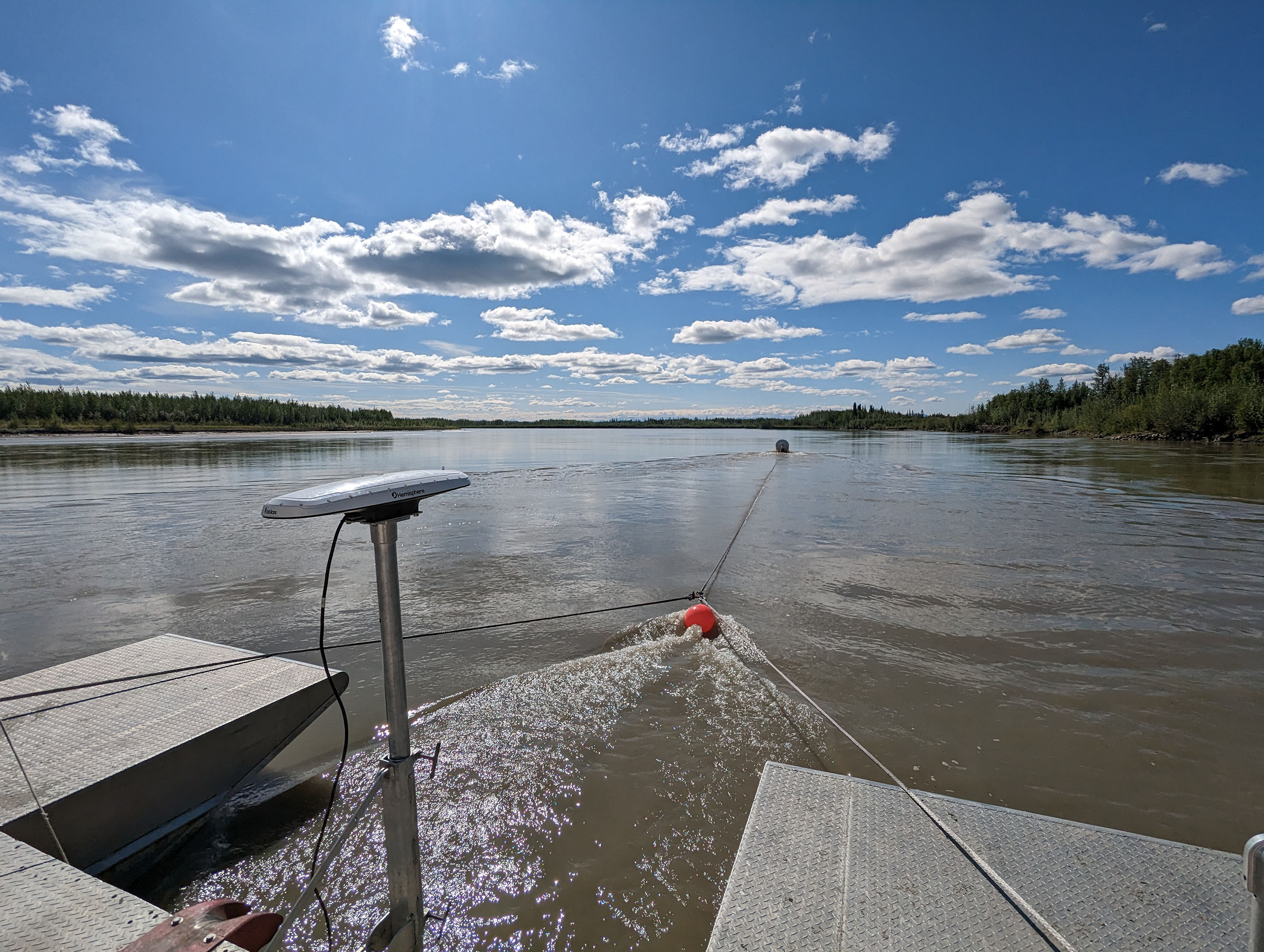 The research barge at the Tanana River Test Site near Nenana points upstream in 2023