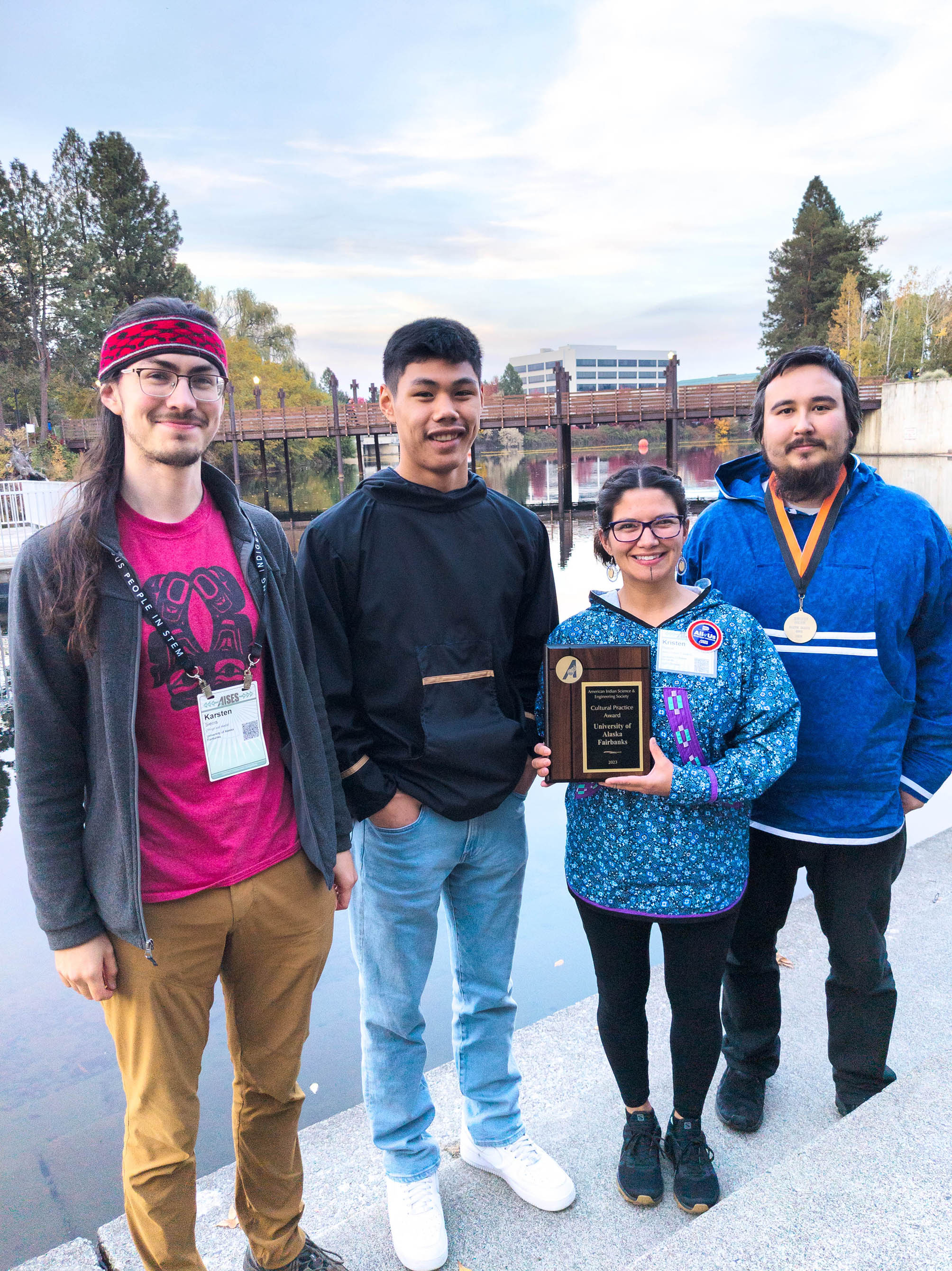 UAF AISES Chapter attendees pose with the Cultural Practice Chapter Award. From left to right: Karsten Sierra, Asa Pitka, Kristen Reece and Bax Bond.