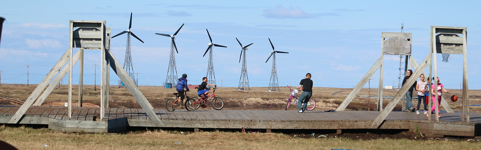 Windmills and kids on a boardwalk