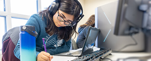 A dual-enrollment student studying