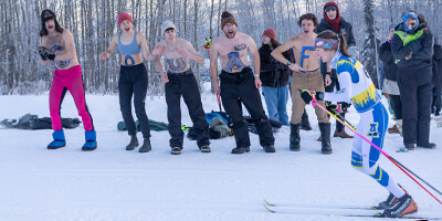 Cross country skier being cheered on