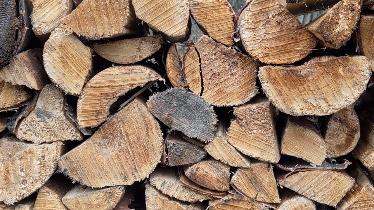 A close up of stacked firewood