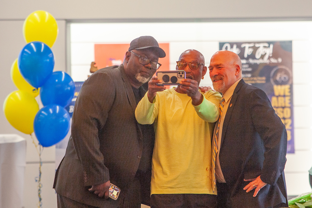 Willie Blakburn, center, takes a selfie photo with UAF Alumni Darryl Lewis Sr., left, and Adam Wool, right, both class of '88, as UAF Alumni gather in the Regents' Great Hall on the UAF campus for the Annual Nanook Rendezvous Alumni Reunion Reception and Alumni Awards Thursday, evening, July 13, 2023. Wool was the 2023 William R. Cashen Service Award recipient.