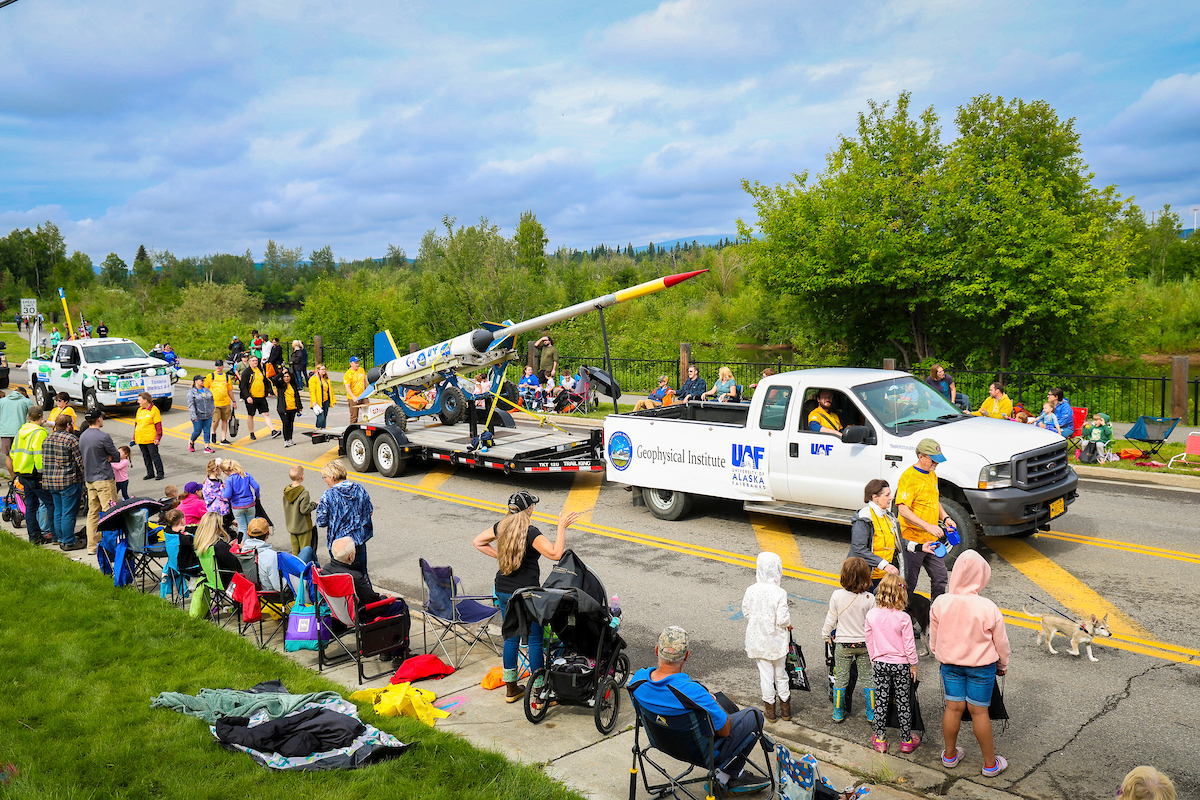 One of the test rockets from the Poker Flats Research Range is pulled through the parade alongside members of the UAF Geophysical Institute during the 2023 Golden Days Parade in downtown Fairbanks.