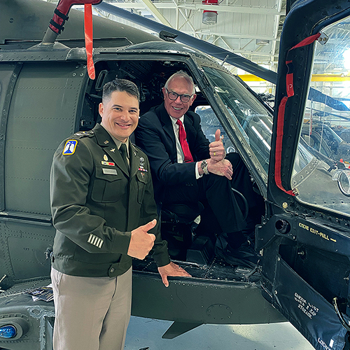 Col. Russ Vander Lugt ‘10, ‘23, UAF’s incoming chancellor, shows Interim Chancellor Larry Hinzman ‘90 a helicopter at Vander Lugt’s change-of-command ceremony at Fort Wainwright in June 2026. Photo courtesy Larry HInzman.