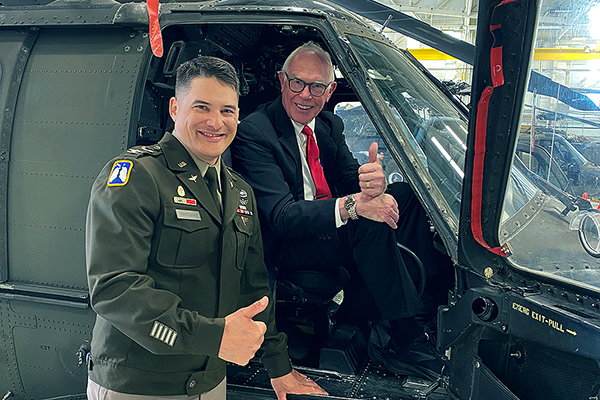 Col. Russ Vander Lugt ‘10, ‘23, UAF’s incoming chancellor, shows Interim Chancellor Larry Hinzman ‘90 a helicopter at Vander Lugt’s change-of-command ceremony at Fort Wainwright in June 2026. Photo courtesy Larry HInzman.