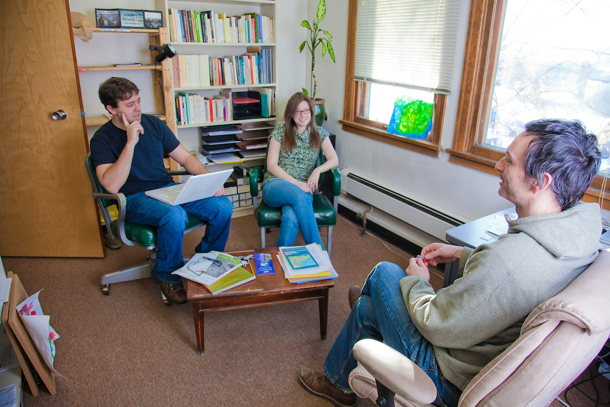 Graduate students Gerad Smith, left, and Nickole Robarge meet with anthropology faculty member Patrick Plattet in his Eielson Building office. | UAF Photo by Todd Paris