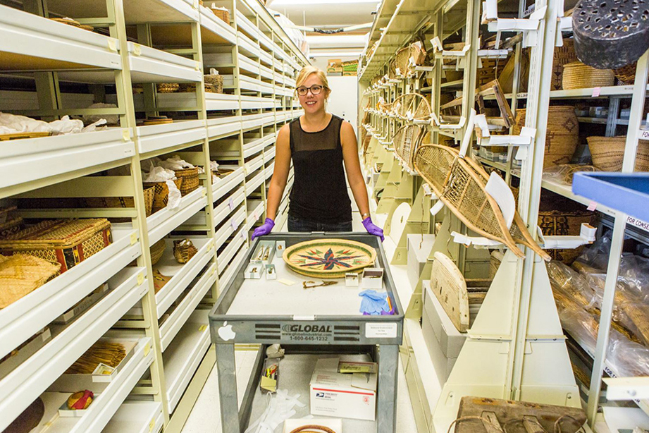 Student assistant Kirsten Olson collects specimens from the stacks at the University of Alaska Museum of the North. | UAF Photo by Todd Paris