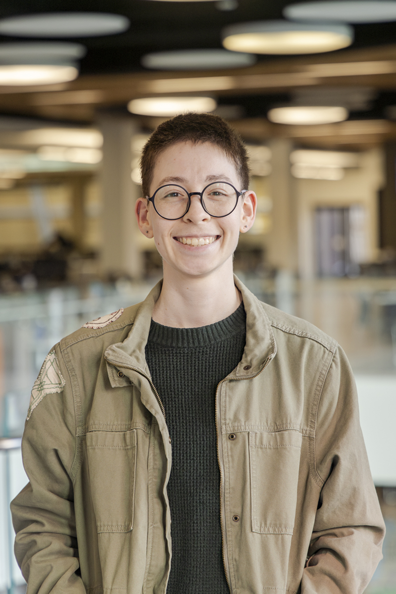 Xochitl Martinez, one of the recipients of the 2025 College of Liberal Arts' Department of Anthropology Outstanding Student Awards take their portrait in the Wood Center, April 18th, 2025. (UAF photo by Leif Van Cise)