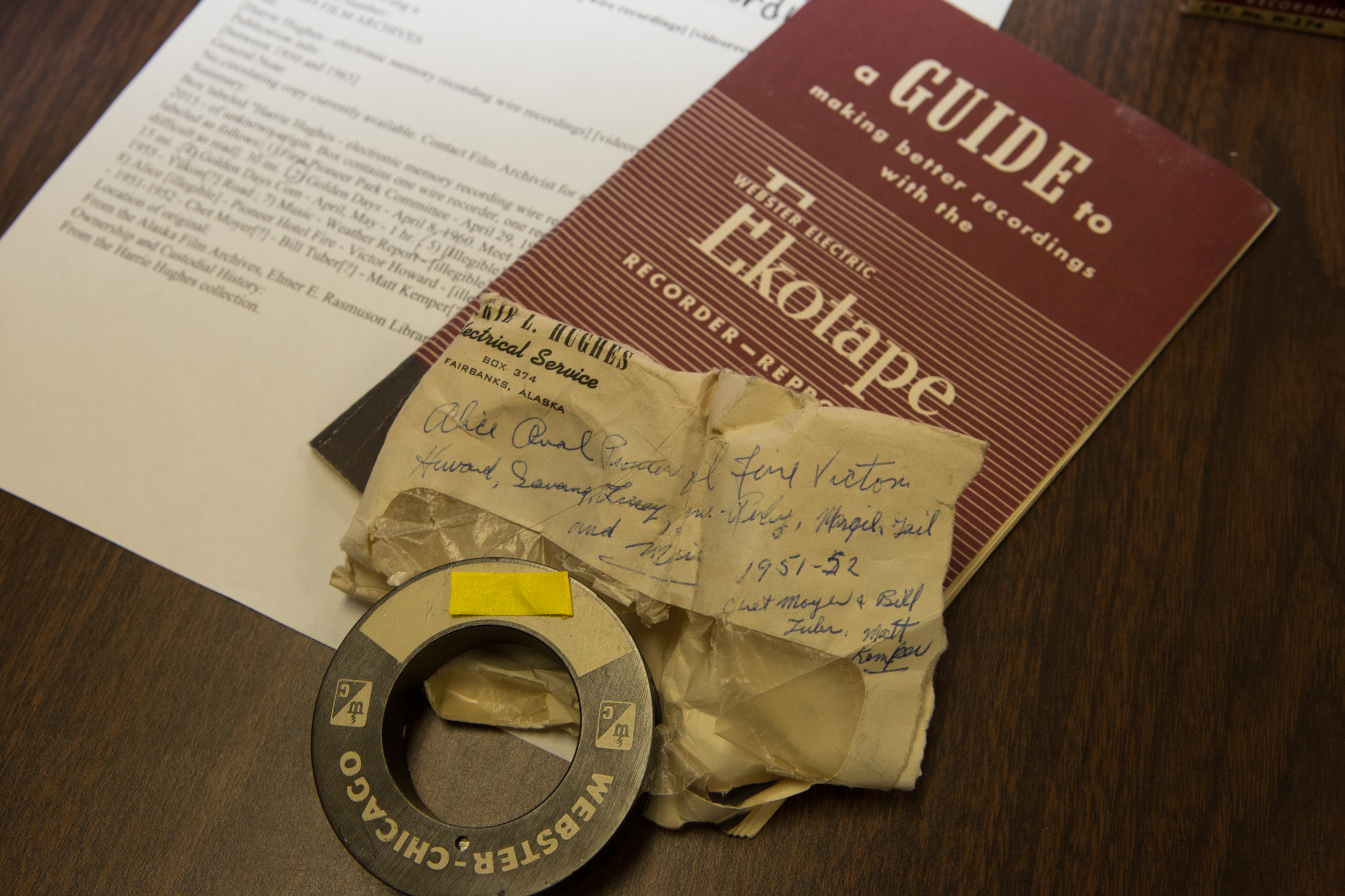 A handwritten note from the 1950s accompanies a recording device and several recording wires that were recently donated to the Oral History program at UAF's Rasmuson Library. The recorder used technology popular through the country in the 1930s-1960s. | UAF Photo by Todd Paris