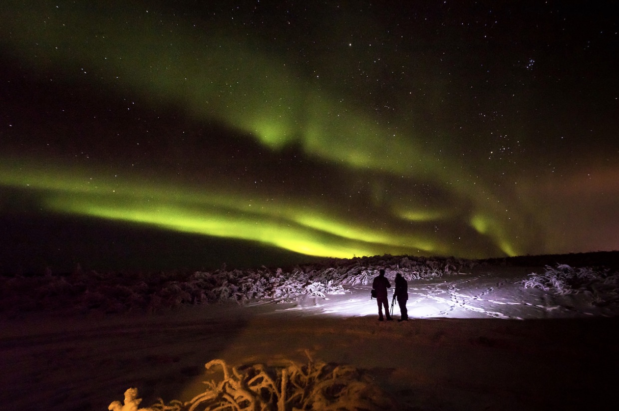 UAF students photograph the aurora during a workshop held by UAF Outdoor Adventures at Murphy Dome.