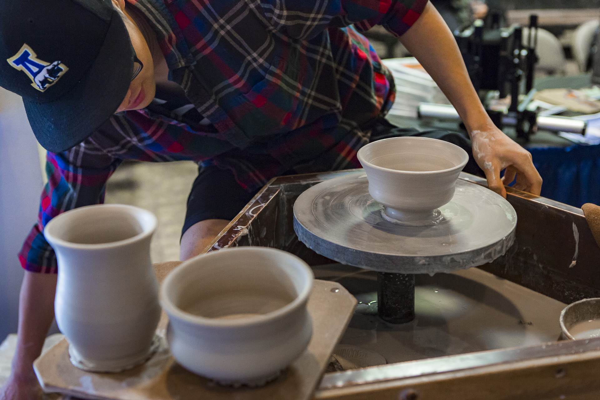 Student at a pottery wheel during the 2015 We Are CLA event